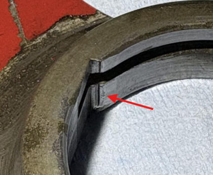 Photograph 7 – Tailwheel steering arm assembly Arrow indicates scratches/gouges at lock notch, from the NTSB investigation of Cessna 305 accident near Phoenix, Arizona, October 18, 2025