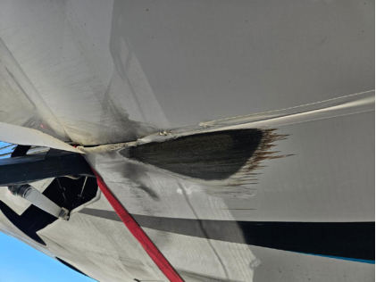 Photograph 4 – Carbon Fiber Abrasion on belly, from the NTSB investigation of Amateur-built Risen SV accident near Carson City, Nevada, December 13, 2025