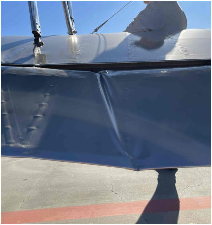 Photograph 2 – Lower left aileron damage, from the NTSB investigation of Boeing PT-13D accident near El Cajon, California, December 19, 2025