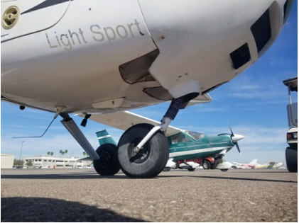 Photograph 2 – View of nose gear buckled, from the NTSB investigation of Remos Acft GMBH Flugzeugbau REMOS GX accident near Glendale, Arizona, February 26, 2026