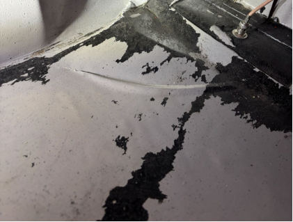 Photograph 5 - View of damage to left side floorboard, from the NTSB investigation of Remos Acft GMBH Flugzeugbau REMOS GX accident near Glendale, Arizona, February 26, 2026
