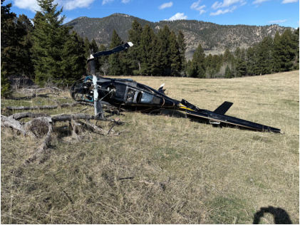 Photograph 2 – View of wreckage from left rear., from the NTSB investigation of Bell Helicopter Textron 206L-1 accident near Chimney Rock, Montana, April 4, 2026