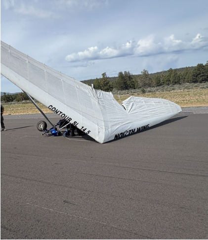 Photograph 1: Aircraft’s wing as viewed from the top side., from the NTSB investigation of Cosmos PHASE II accident near Prineville, Oregon, May 2, 2026