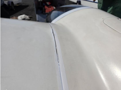 Photograph 1 – View of top left wing broken tape., from the NTSB investigation of Pzl-Swidnik PW-5 accident near Soap Lake, Washington, May 23, 2026