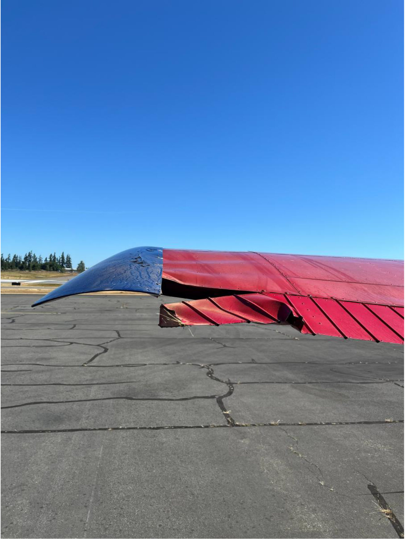 Photograph 3 – View of left aileron damage, from the NTSB investigation of Cessna 180H accident near Port Angeles, Washington, June 21, 2026