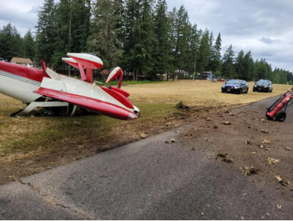 Figure 1: View of airplane’s final resting position next to runway., from the NTSB investigation of Amateur-built RV-7A accident near Covington, Washington, July 17, 2026