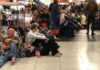 People Waiting At The Airport