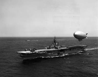 A U.S. Navy airship hovers over the carrier Leyte refueling (May 5, 1955)