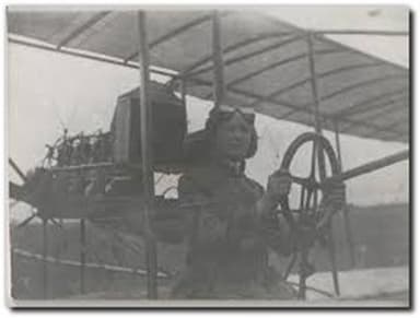 Bessie at the Controls of the Family Biplane