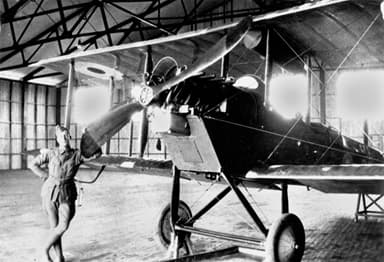 Mechanic with a De Havilland DH6 Two-Seater Biplane