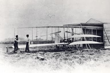 Orville and Wilbur Wright with Wright Flyer II at Huffman Prairie (May 1904)