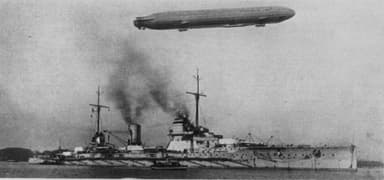 The German Battlecruiser SMS Seydlitz with a Zeppelin Overhead